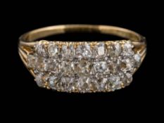 A diamond mounted three-row half-hoop ring,