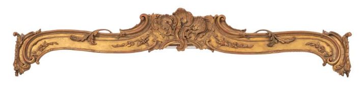A Victorian carved giltwood pelmet: of rococo scroll design centred by scrolling rocaille and