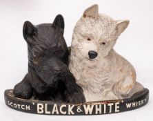 A mid 20th century 'Black & White' Scotch whisky advertising model of two Terriers on a demi lune