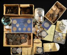 A collection of tins and boxes containing world and English coins including some pre-1947 silver.
