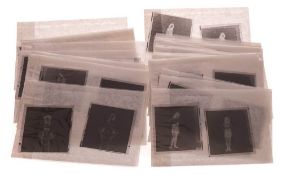 A group of mid 20th century negatives of female nudes and striptease.