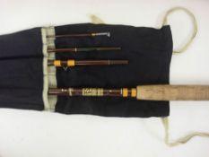 A Hardy 'Smuggler' No 6 8ft / 244cm fishing rod in canvas bag and associated leather rod case.