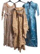 A mid 20th century Chinese blue silk dress with floral decoration,: together with a racoon fur coat,