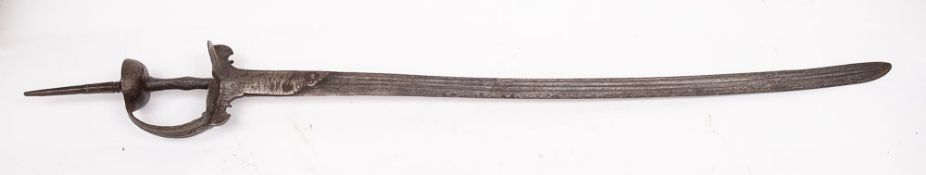 A 19th Century Tulwar: the slightly curved single edged blade with double fuller over hilt of