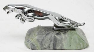 A chrome plated Jaguar car mascot mounted on an onyx base, 9cm high.