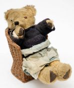 A 20th century blonde plush Teddy bear: with glass eyes,