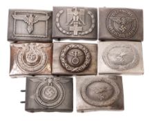 A collection of eight reproduction German belt buckles.