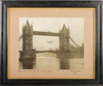 An early 20th century photograph of a hydroplane flying though Tower Bridge, circa 1912:,