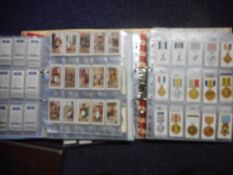 Players sets of cigarette cards: Butterflies 50/50, Curious beaks 50/50,