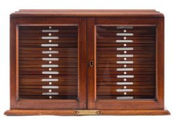 A late 19th/early 20th century mahogany and glazed mahogany microscope slide cabinet with a