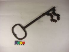 An early 20th century large iron key, possibly a shop advertising sign:, 54cm long.