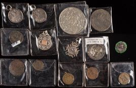 A collection of four silver fobs,: three for gymnastics,