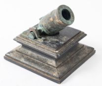 A 19th century cast bronze desk mortar on an ebony plinth, 12cm high.