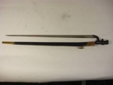 An 1876 pattern Martini Henry bayonet: the triangular blade stamped and dated with various markings