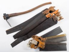 A group of three tennon saws, five crosscut saws and an adze,