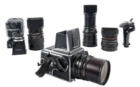A Hassellblad 500CM square/medium format camera serial number RU1405742: together with four backs,