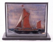 An early 20th century cased waterline model of the Thames Barge 'E & Co',