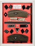 A framed collection of reproduction German SD uniform.