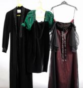 A group of seven various black evening dresses: (no maker's labels)