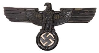 A reproduction WWII German Eagle crest: together with a silver plated trumpet with reproduction