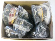 A collection of seven reproduction German military peaked caps.