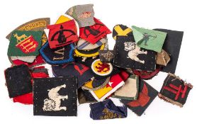 A small assortment of WWII period British cloth insignia.