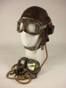 An RAF C type flying helmet together with two pairs of MK VIII. goggles.