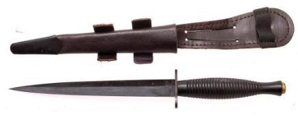 A Fairbairn Sykes pattern fighting knife: stamped 'Sheffield, England',