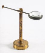 A 19th century lacquered brass bullseye condenser: with 1 1/2 inch lens on a sliding adjustable