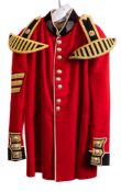 A Scots Guards Sergeant Bandsman tunic with epaulettes in gold braid.
