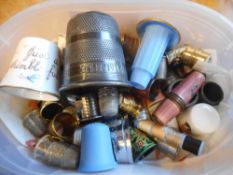 A collection of porcelain, metal, pewter and plastic thimbles: including American place names,
