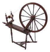 A 19th Century beechwood and fruitwood Saxony pattern spinning wheel: with turned spindle spokes