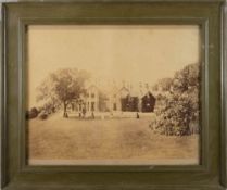 An early 20th century photograph of a croquet game at a country house,