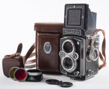 A Rolleiflex twin lens reflex camera: with Carl Zeiss 75mm lens in leather case.