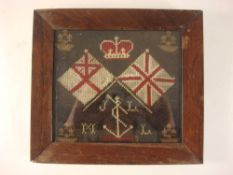 A late 19th/early 20th century sailor's woolwork valentine: with crown over crossed flags and foul