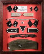A framed collection of reproduction German SD uniform.