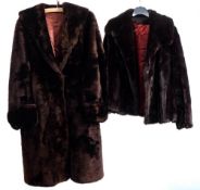 A mid 20th century brown fur coat by Tescan together with a black fur jacket by Clive: (2)