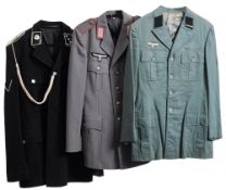 A group of six reproduction German uniforms.