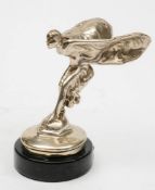 A Rolls-Royce Spirit of Ecstasy radiator mascot, mounted on a marble socle, 15cm high.