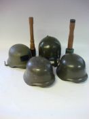 A group of three reproduction German helmets: together with a reproduction helmet with nose guard