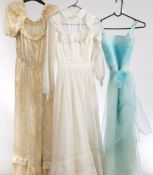 A 1970s white silk floral pattern wedding dress: together with a white nylon wedding dress and an