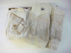 A collection of lace and cutwork items: including serviettes and a camisole.