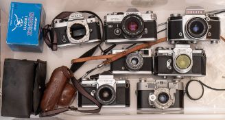 A group of eight 35mm SLR cameras: including an Exata Vares IIb, an Olympus Trip 35,