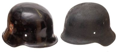 A M1934 pattern German helmet and an M42 pattern helmet: (2)