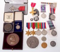 A collection of various medals and medallions including a Victorian Indian service medal (no