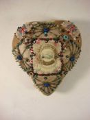 A First World war sweetheart cushion: the central celluloid panel surrounded by beaded pins and