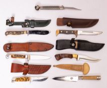 A group of various hunting knives: including a Puma angler's knife with priest pommel,