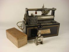 An early 20th century black lacquer Dictaphone by the American Gramophone Co,
