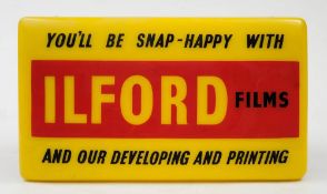 An Ilford Films illuminated advertising sign by Brunham & Co, London:,