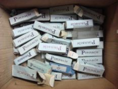 A collection of boxed Pinnacle glass valves:
